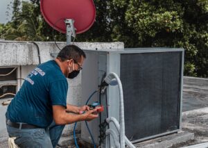 HVAC technician installing 2 line sets